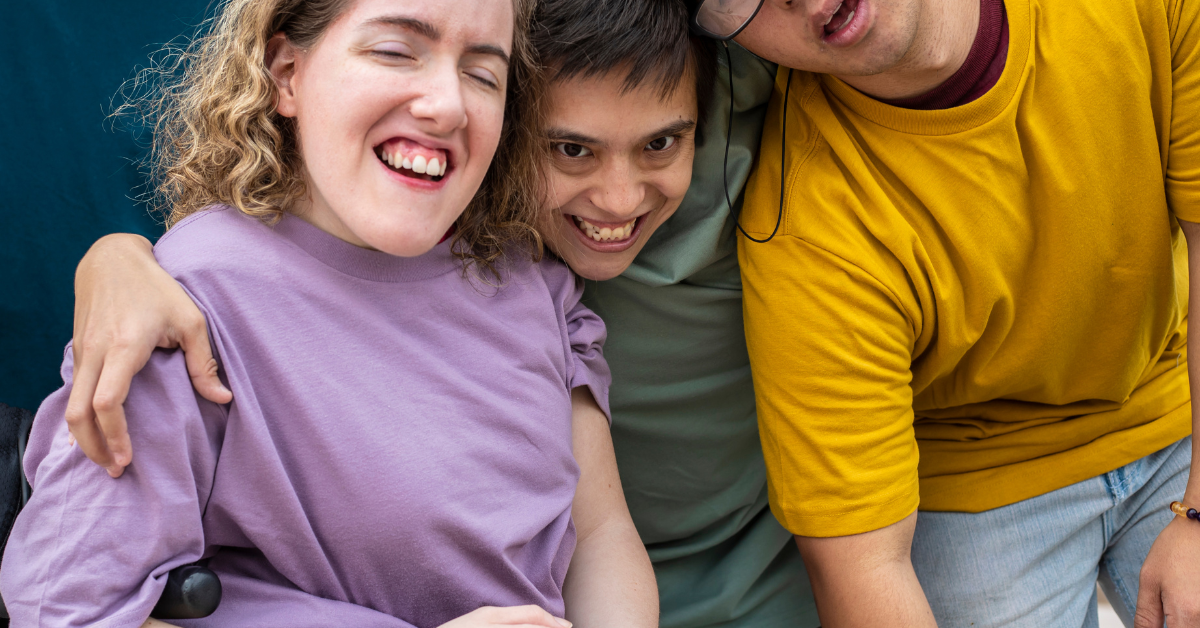 Happy friends embracing and laughing together